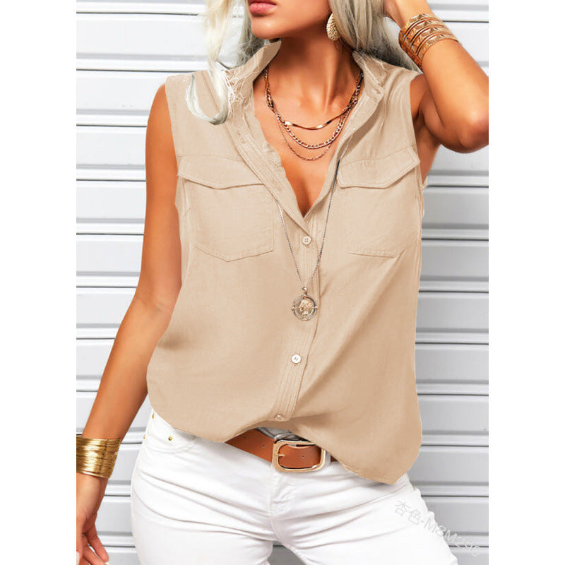 Woman wearing a beige sleeveless shirt with white pants against a light background