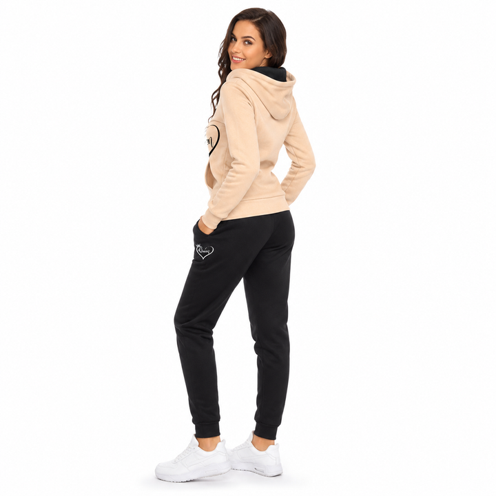 Women loungewear tracksuit set with ankle length joggers and pullover hood, ideal for relaxed cold season outfits at home now
