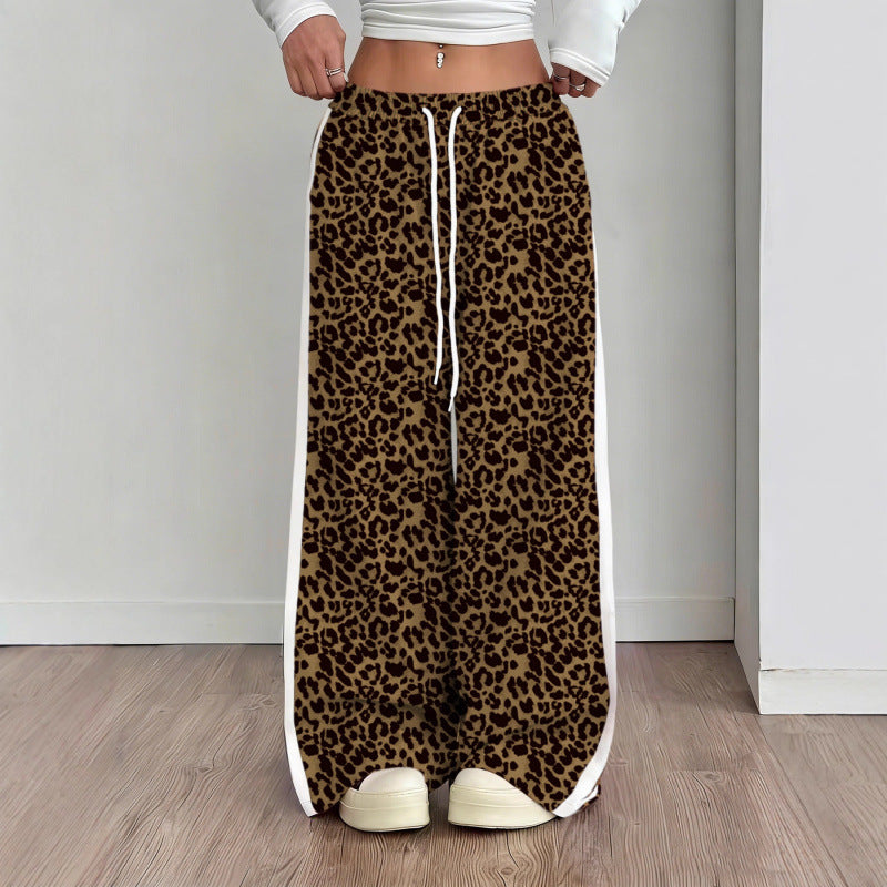 Leopard print pants with white drawstring and trim on a plain background