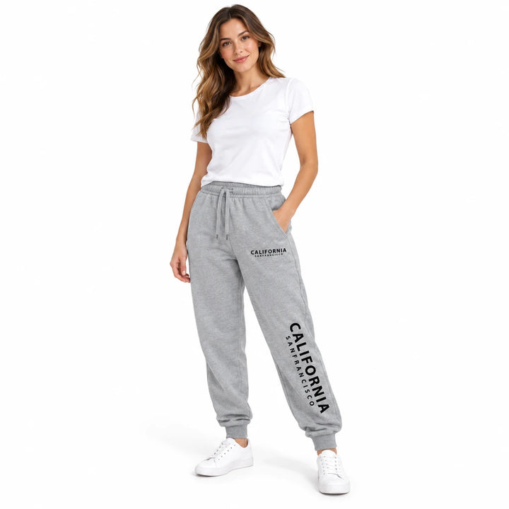 Heather gray California sweatpants worn by a female model with a white T-shirt and white sneakers, in a white studio setting.