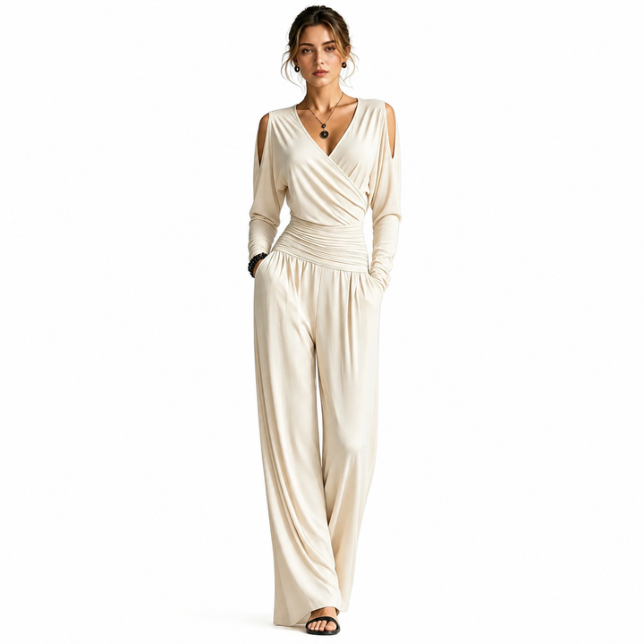 Apricot Milk Silk jumpsuit on a woman with visible face, V-neck wrap bodice, cold-shoulder sleeves, ruched waist and wide-leg pants.