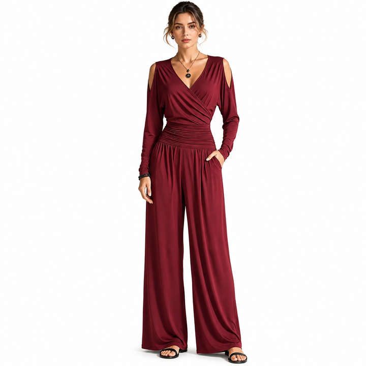 Wine Red Milk Silk jumpsuit on a woman with visible face, wrap V-neck, cold-shoulder sleeves, ruched waist and wide-leg pants.