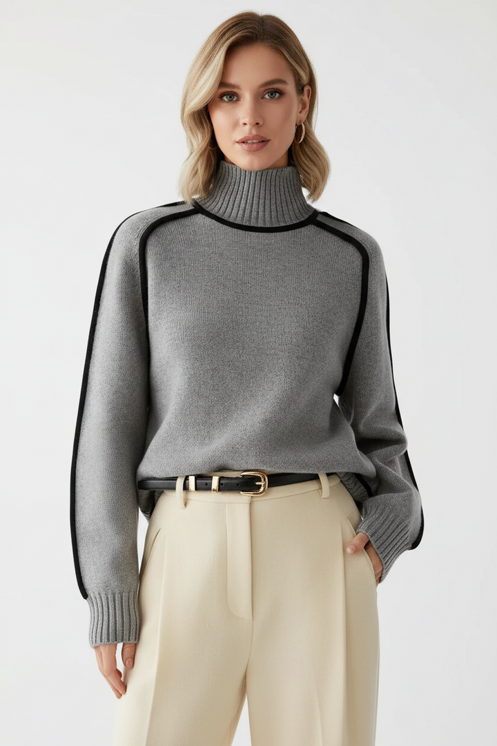 Close fabric view of the knit blend texture with contrast trim for a refined modern sweater look