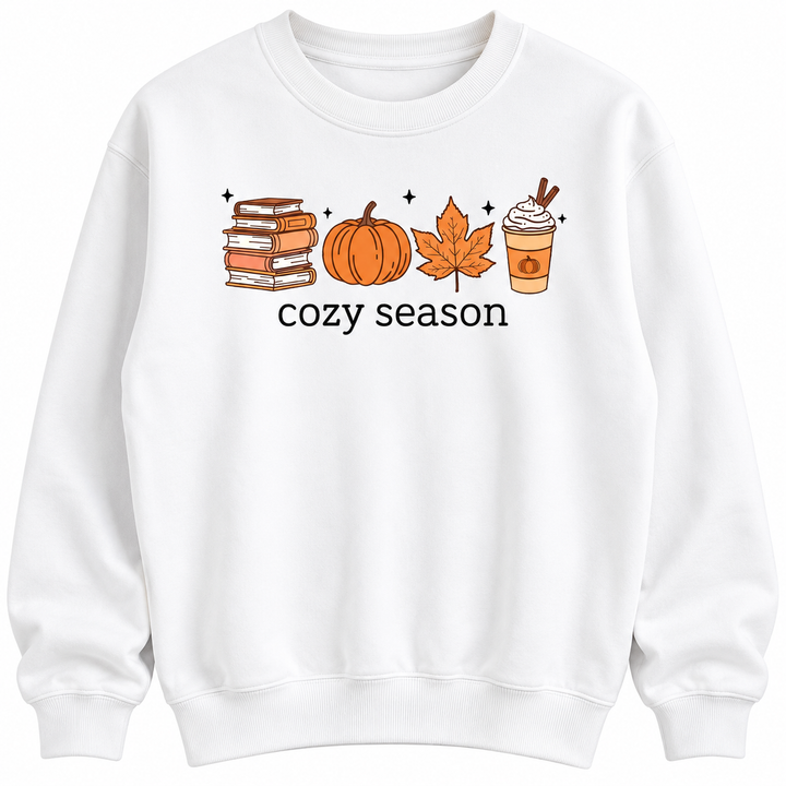 Close-up of the white sweatshirt showing the crew neckline books, pumpkin, maple leaf, latte and black cozy season lettering.