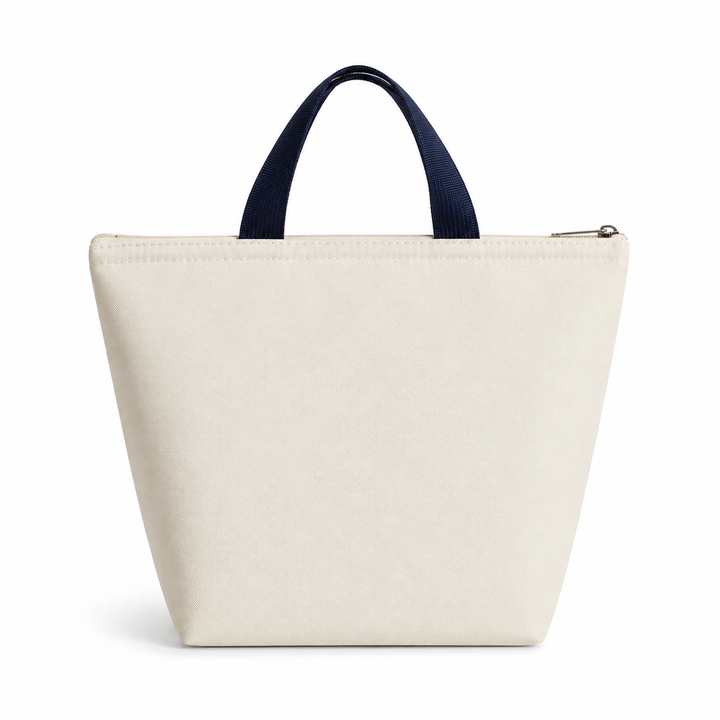 Navy handled cream lunch tote displayed from the back on white highlighting its simple tapered shape and zip-top construction