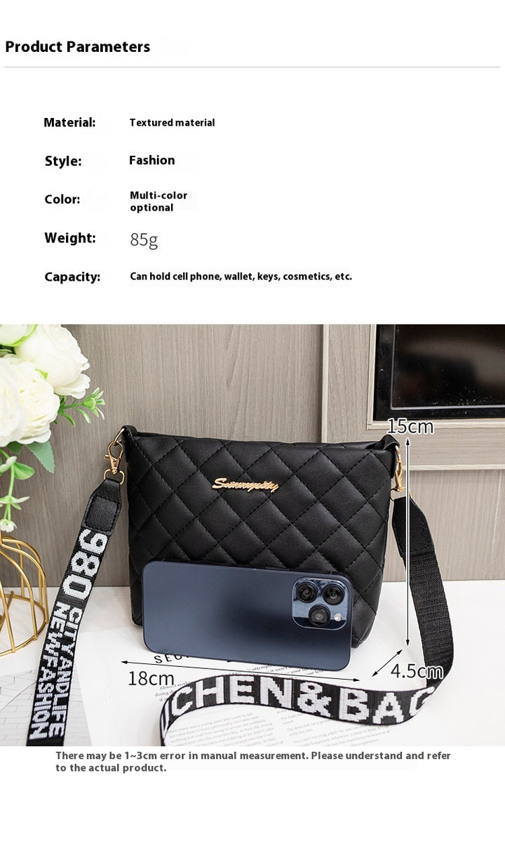 PU leather crossbody bag for women displayed to show its bucket shape, shoulder strap, quilted pattern and chain details.