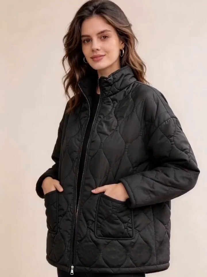 Black quilted coat with the model&