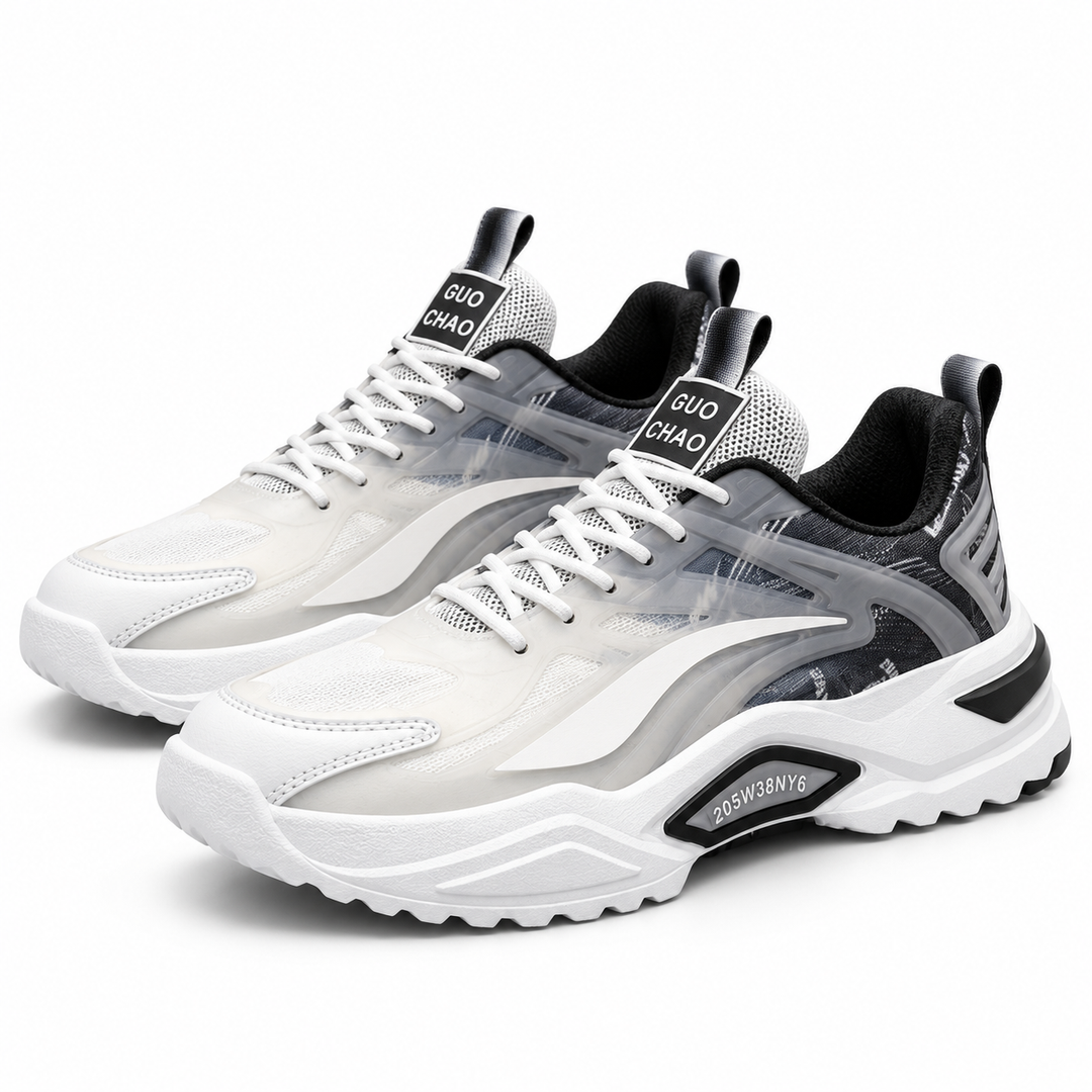 Dad sneakers for men in white and black with thick sculpted soles, layered upper, white laces and low-top casual sneaker shape.