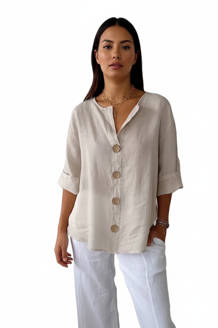 loose fit women's v-neck linen button shirt warm orange hue twist buttons soft drape relaxed pose natural light
