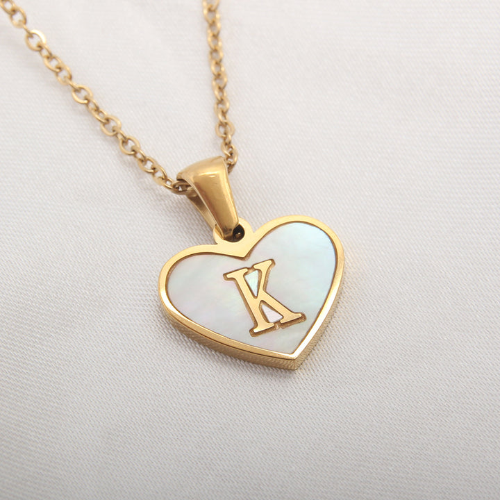 Gold-plated letter pendant necklace with heart design, stainless steel material and selectable initials - Buyer product view.