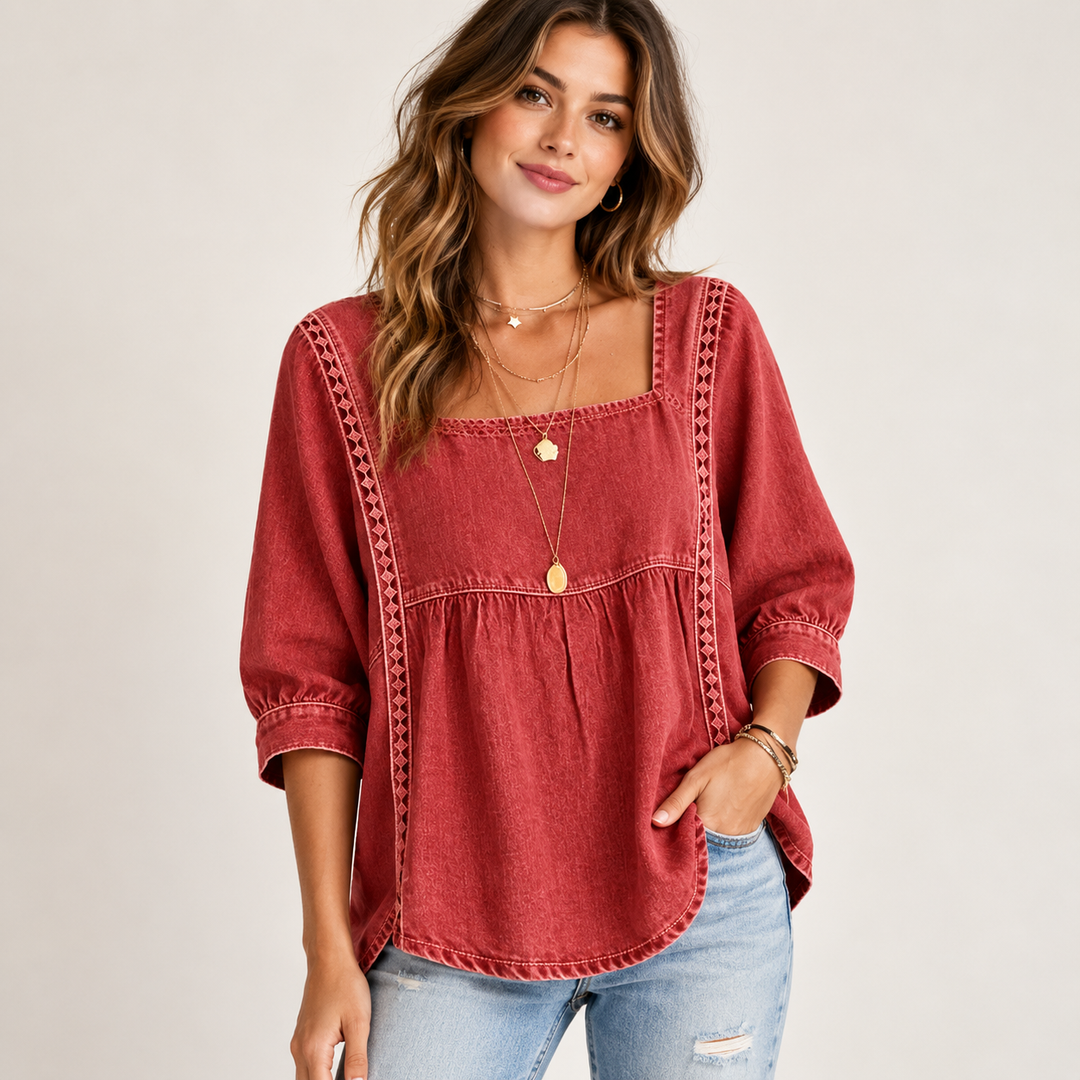 Red lace patchwork blouse on a model with square neckline, gathered seam, regular sleeves and casual denim styling.