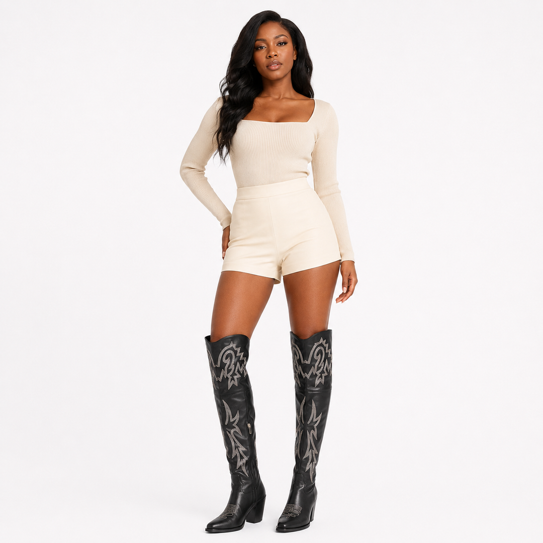 Black denim thigh high Western boots for women shown in a premium angled editorial pose on a white studio background.