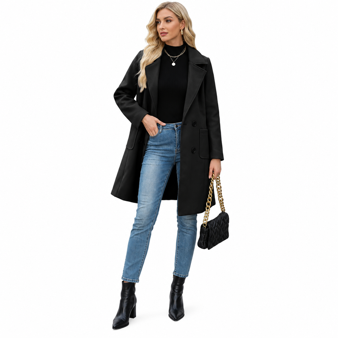 Black coat styled with a black top and jeans