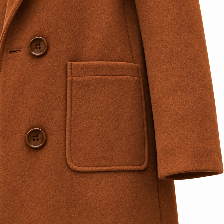 Close-up of the brown coat patch pocket and sleeve cuff
