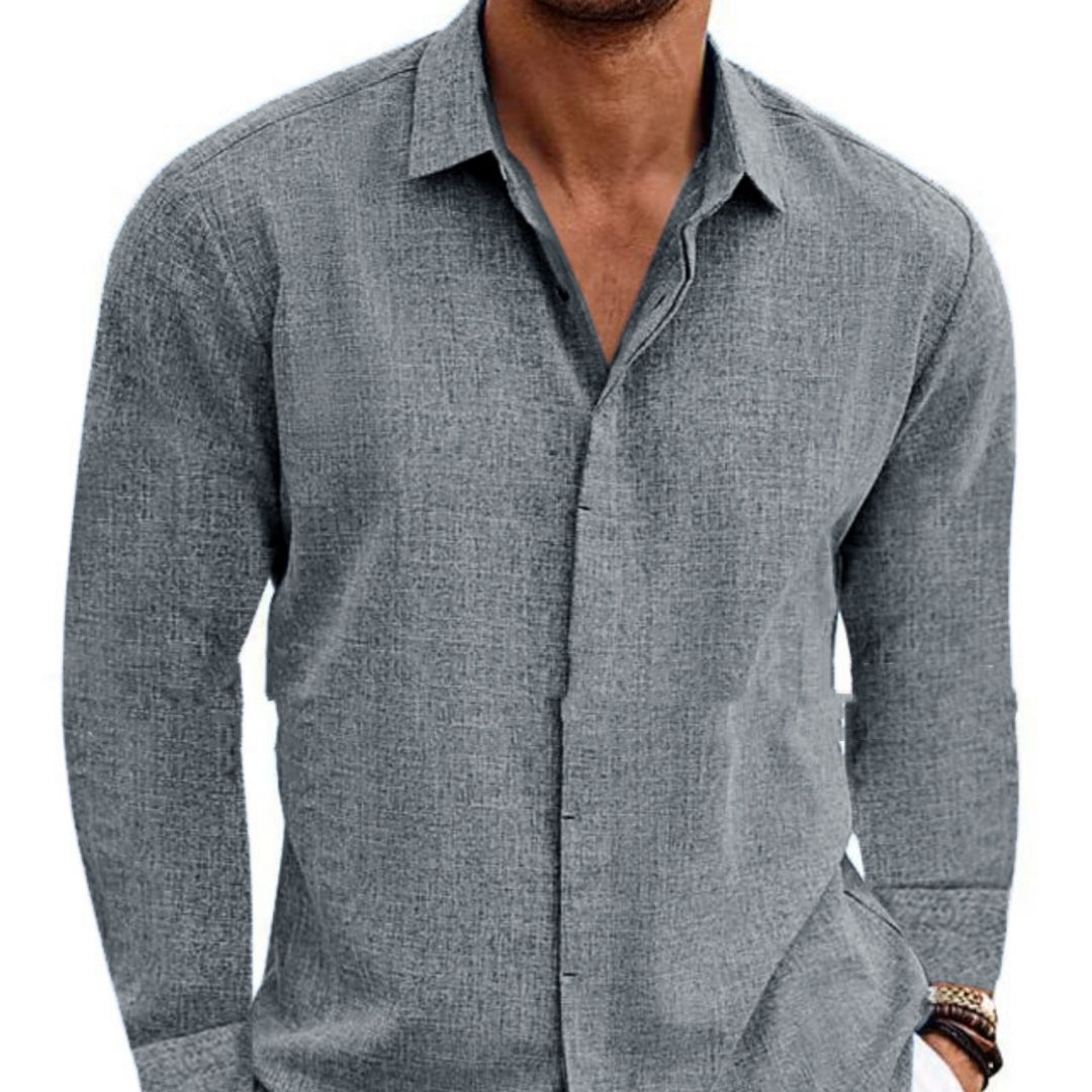 Gray button-up shirt worn by a person on a white background