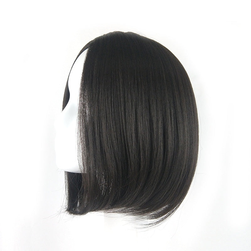Close-up of short wig hairline and smooth texture in dark brown shade