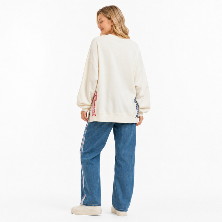 Cream patriotic sweatshirt styled for summer gatherings, travel days and everyday comfort with applique star details all day!