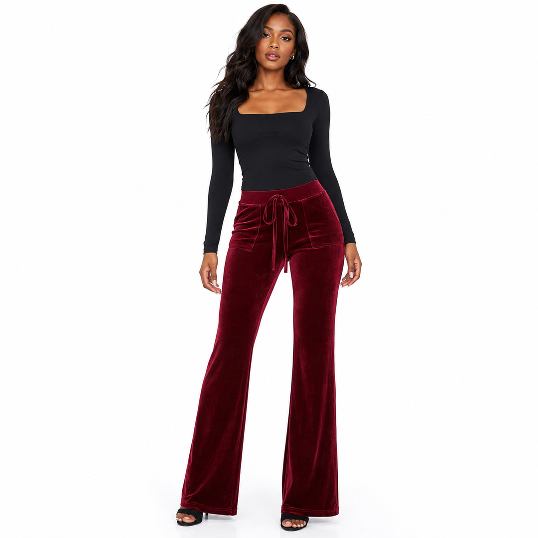Flared office trousers for women with velvet fabric flexible movement and a structured silhouette for work and evening looks.