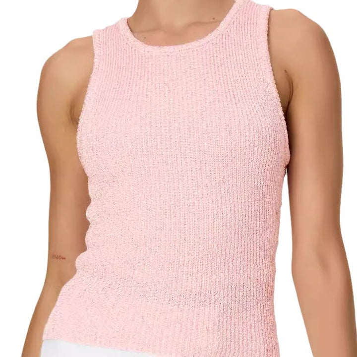 Pink knitted sleeveless top worn by a person on a white background