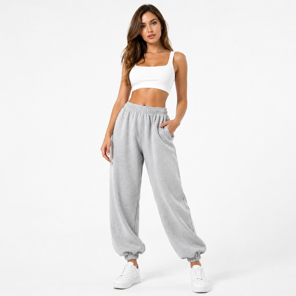 Side angle of relaxed fit joggers showing roomy leg and tapered ankle detail