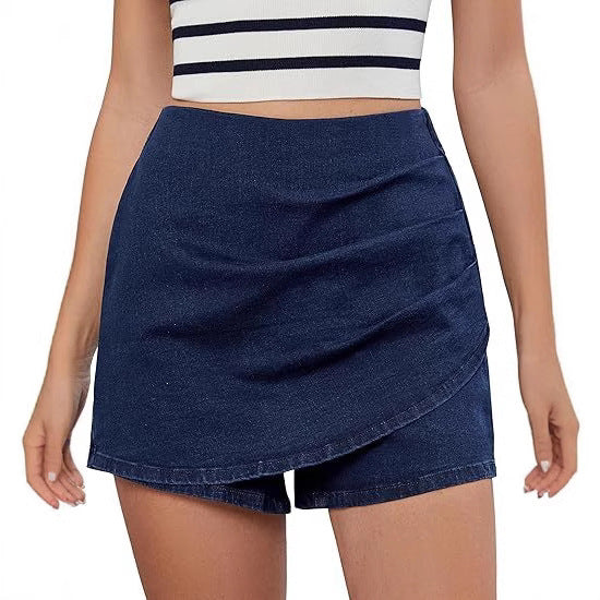 high waisted stretch denim shorts dark blue on model dancing lightly to demonstrate pleated culotte shorts flow and comfort during active moments with elegant high waisted shorts design perfect for sports and leisure