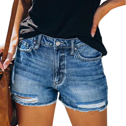 "fringe denim shorts flat lay showing frayed hem and short length in black, pairs with white tee for commute-ready style"
