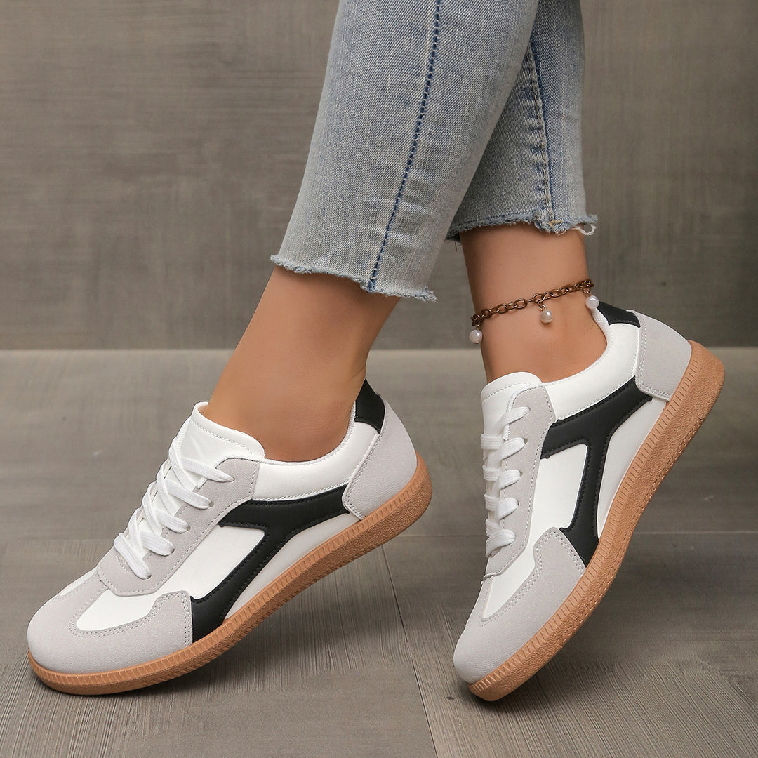 Black women’s sneakers with non-slip rubber sole and polished streetwear finish