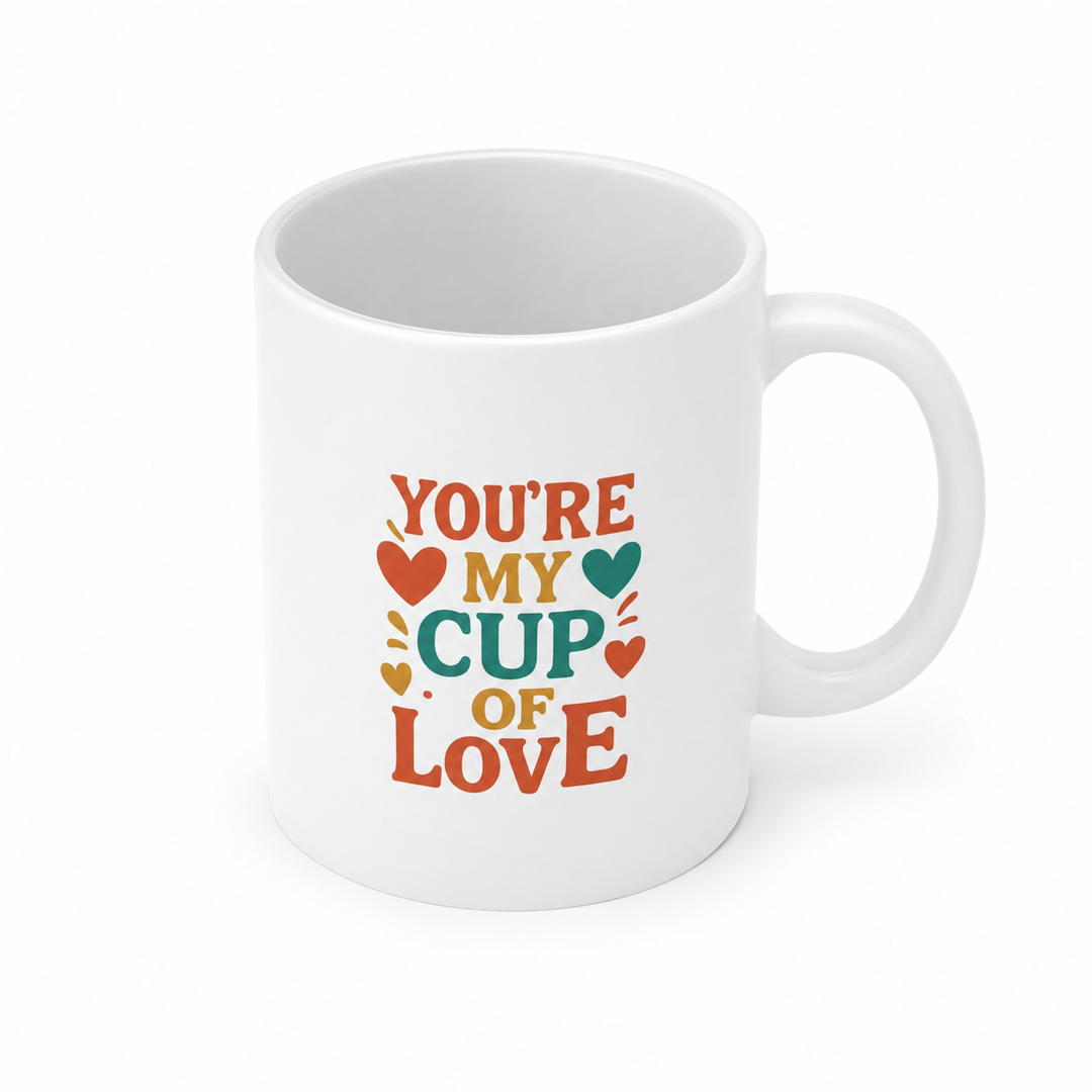 Glossy heart shaped mug with vibrant colors and a distinctive heart handle, presented as a thoughtful gift for coffee lovers.
