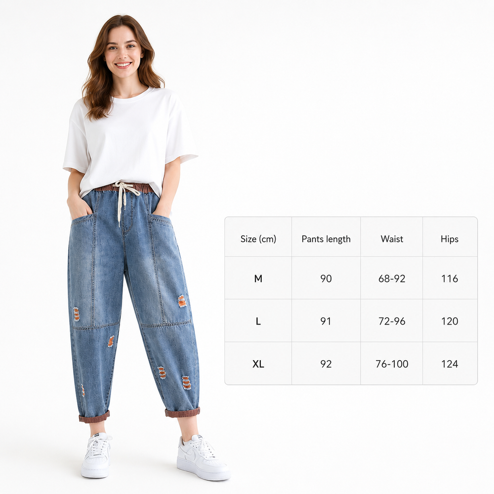 Quality women's denim pants with distressed detail, drawstring waist, roomy pockets, and an easy everyday look.