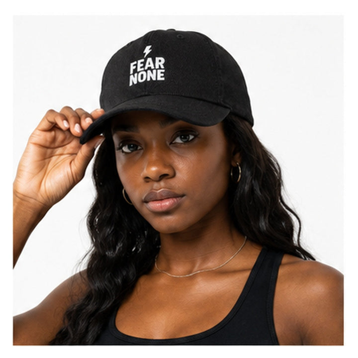 Close-up of Fear None embroidered black denim cap on female model
