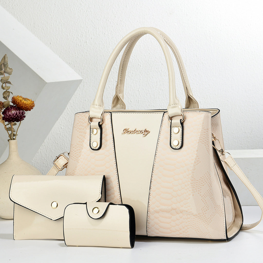 Beige handbag and wallet set on a white background