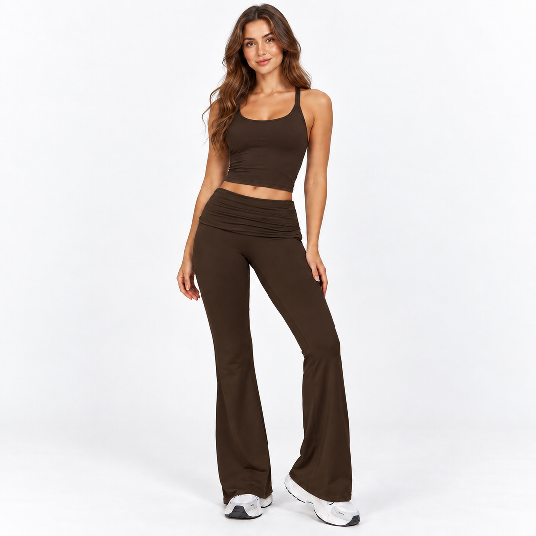 Black Coffee flared activewear pants on full-body model against a clean white studio background
