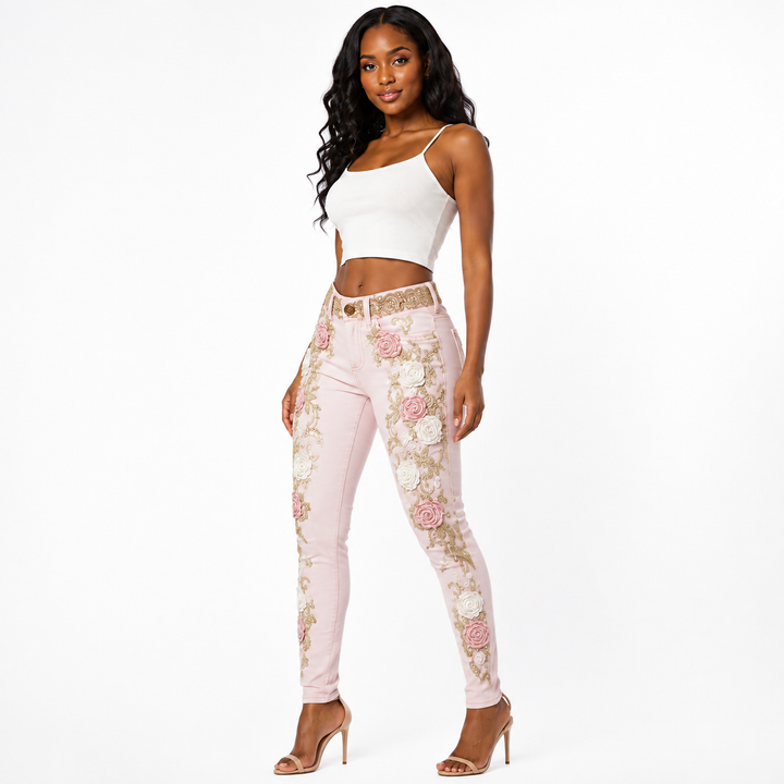 Pink floral embroidered jeans with rose appliques - three-quarter view on Black woman model