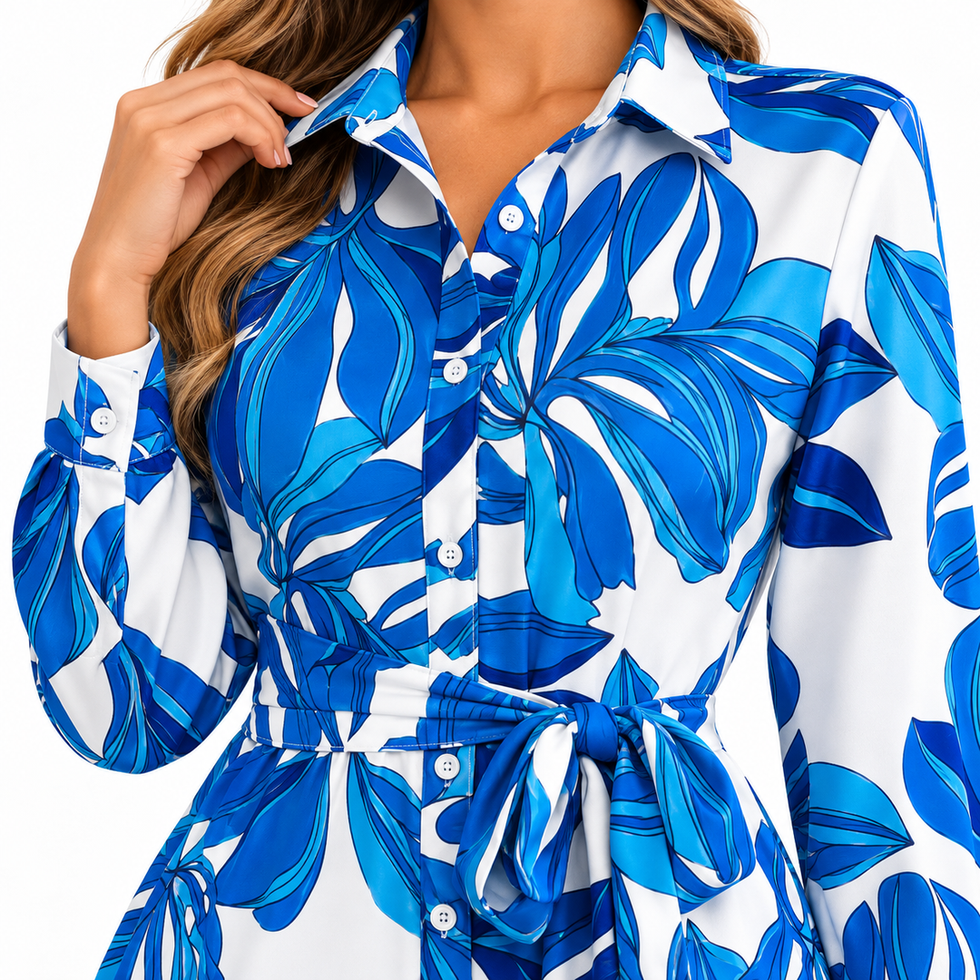 Blue floral shirt dress close-up showing collar, buttons, tie waist and cuff