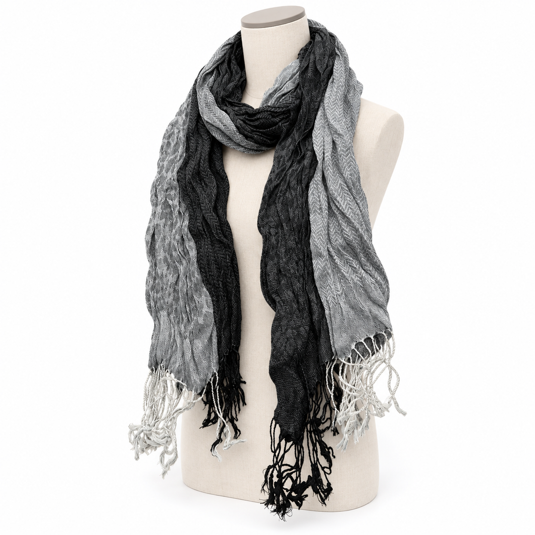 Three-quarter draped view of the long jacquard wrap showing its woven pattern.