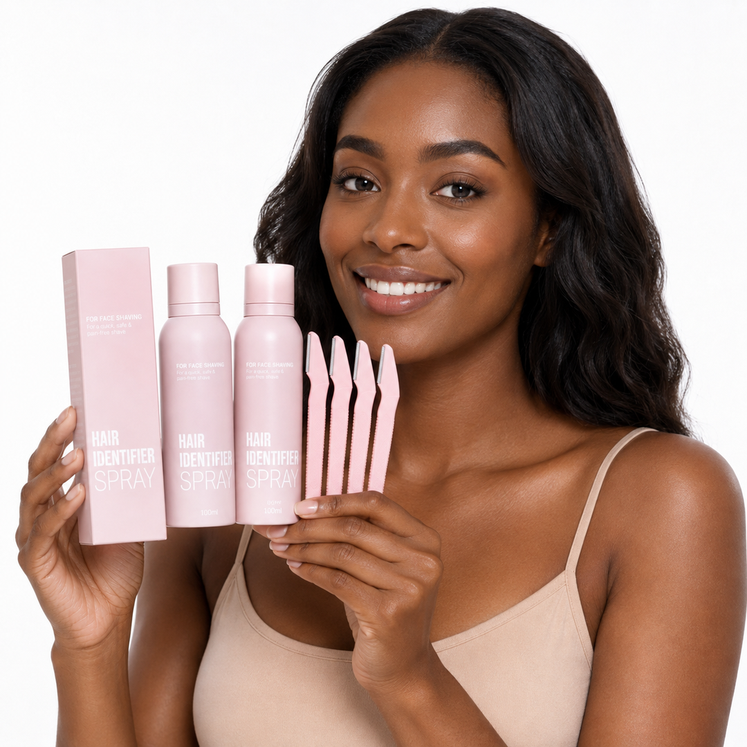 Four-piece Hair Identifier Spray set with pink bottle, box and grooming tools held by a professional model on white background.