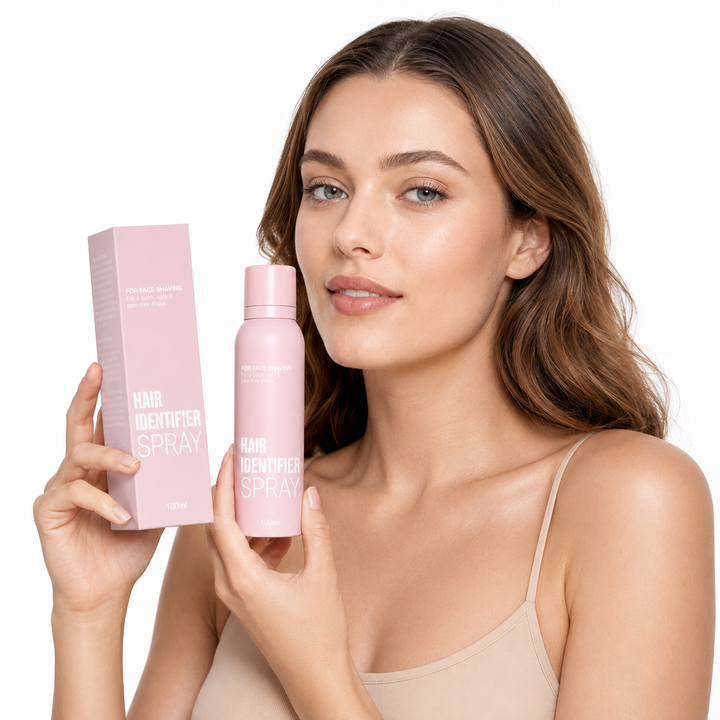 Hair Identifier Spray hero shot with pink 100 ml bottle and matching box shown by a professional model on a white background.