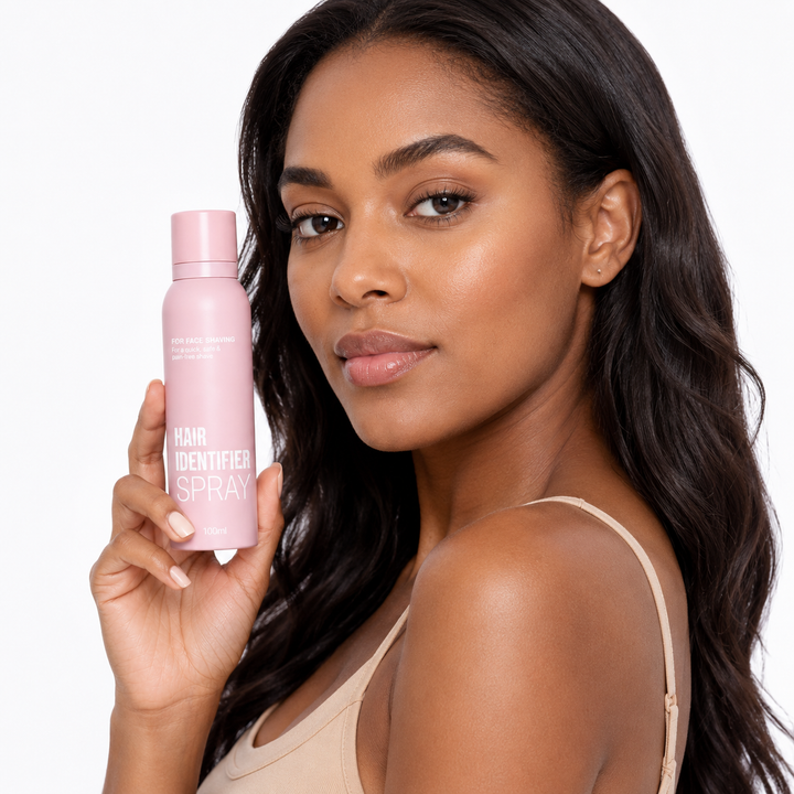 Pink Hair Identifier Spray bottle presented by a professional model in a three-quarter beauty pose on a white studio background.