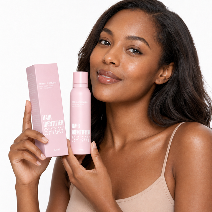 Hair Identifier Spray set with pink 100 ml bottle and box shown by a professional model on a clean white studio background.