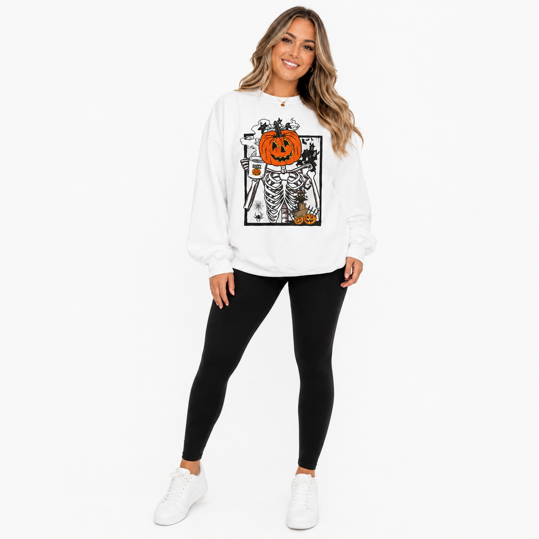 Woman wearing white Halloween pumpkin sweatshirt with pumpkin skeleton graphic in a full-body studio product view.