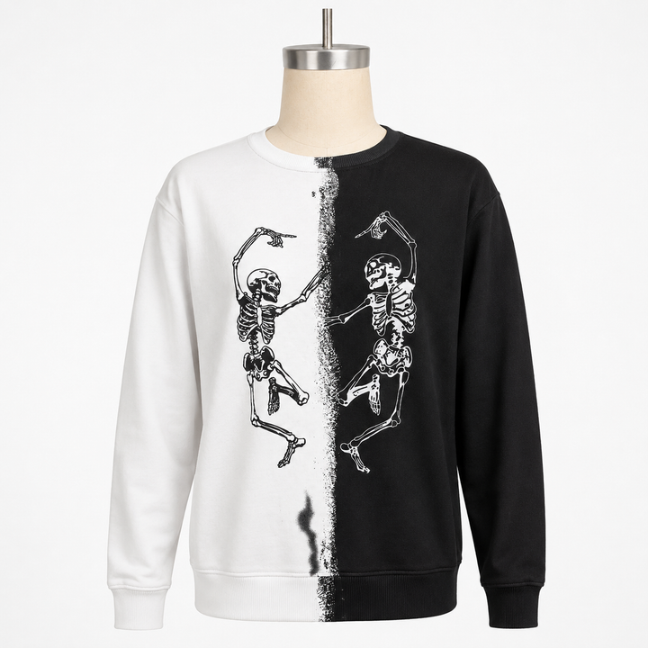 Ivory and black Halloween skeleton sweatshirt with dancing skeleton print on a clean white studio background.