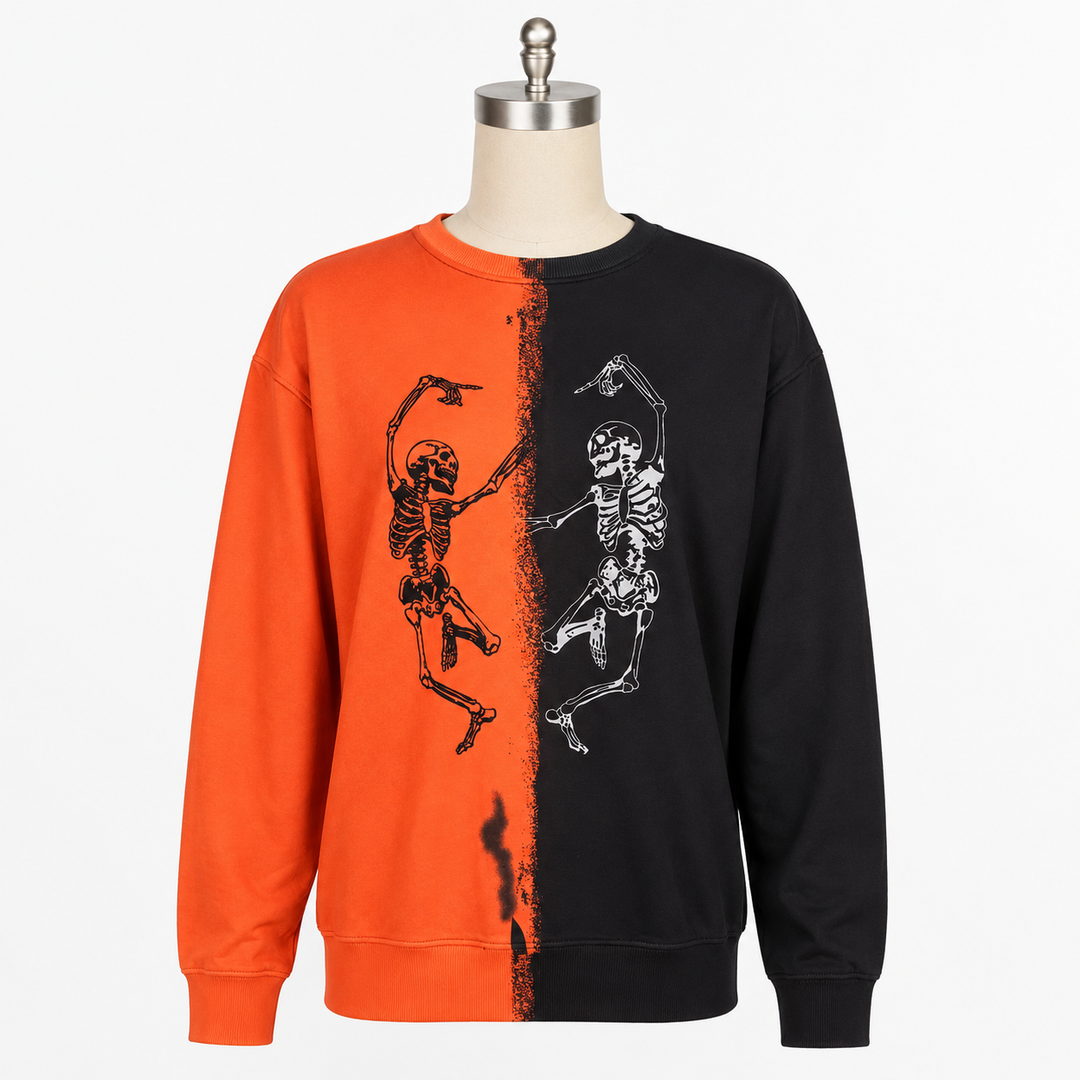 Orange and black Halloween skeleton sweatshirt with dancing skeleton print on a clean white studio background.