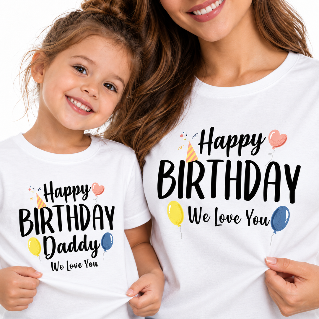 Close-up of matching adult and child birthday shirts highlighting the printed birthday designs on white tops.