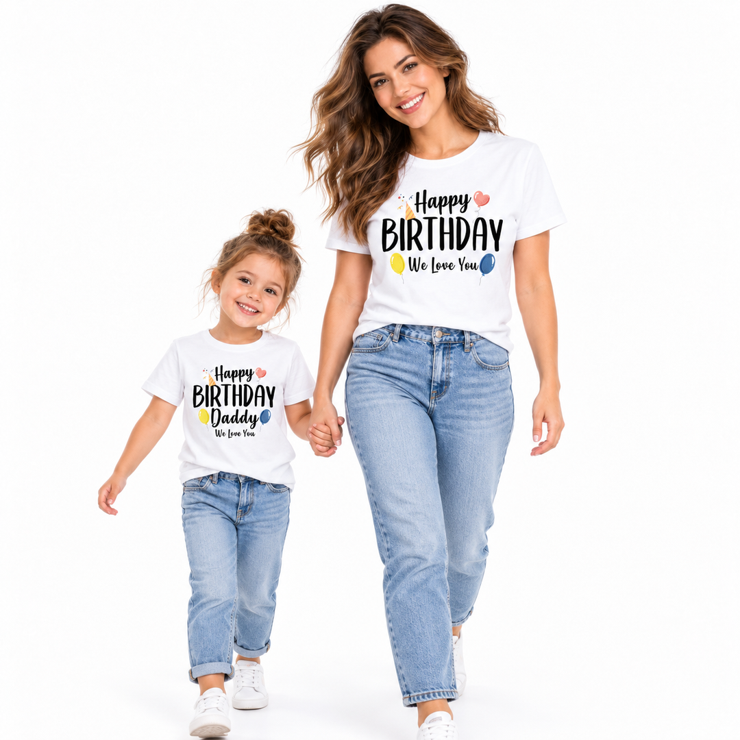 Adult and child walking together in coordinated Happy Birthday family shirts on a clean white studio background.