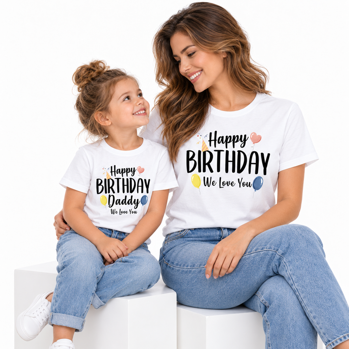 Adult and child sitting together in coordinated birthday shirts with the Happy Birthday Daddy print clearly visible.