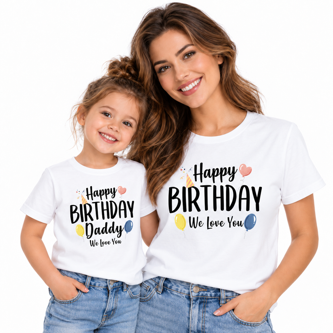Adult and child wearing coordinated Happy Birthday and Happy Birthday Daddy shirts on a white studio background.