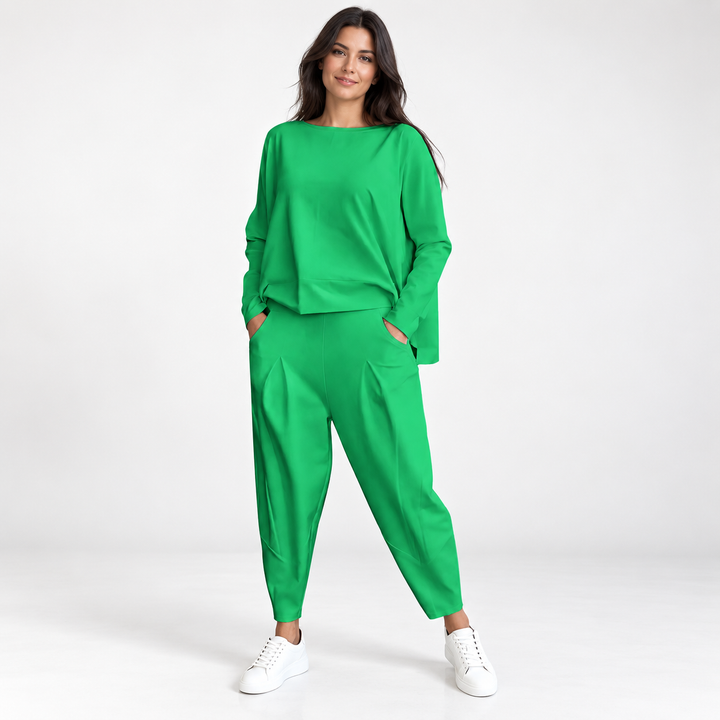Harem pants set for women in green with round neck top and tapered matching pants on a professional studio model