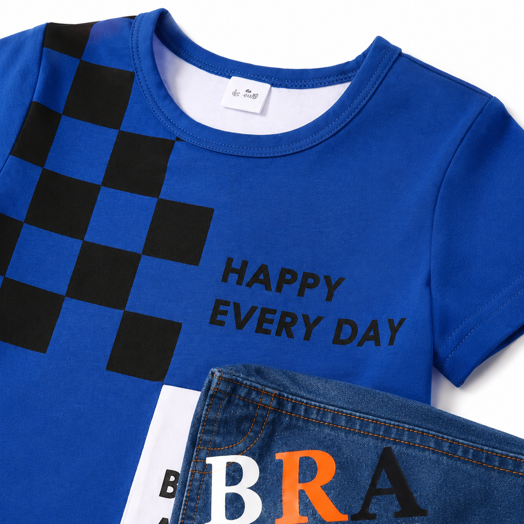 Close-up of kids navy graphic tee neckline, stitching, checker print and denim texture for detailed product inspection.