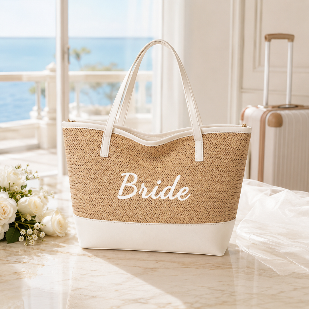 Bride woven seaside tote bag in a bright travel setting with light khaki body, white trim and long shoulder handles