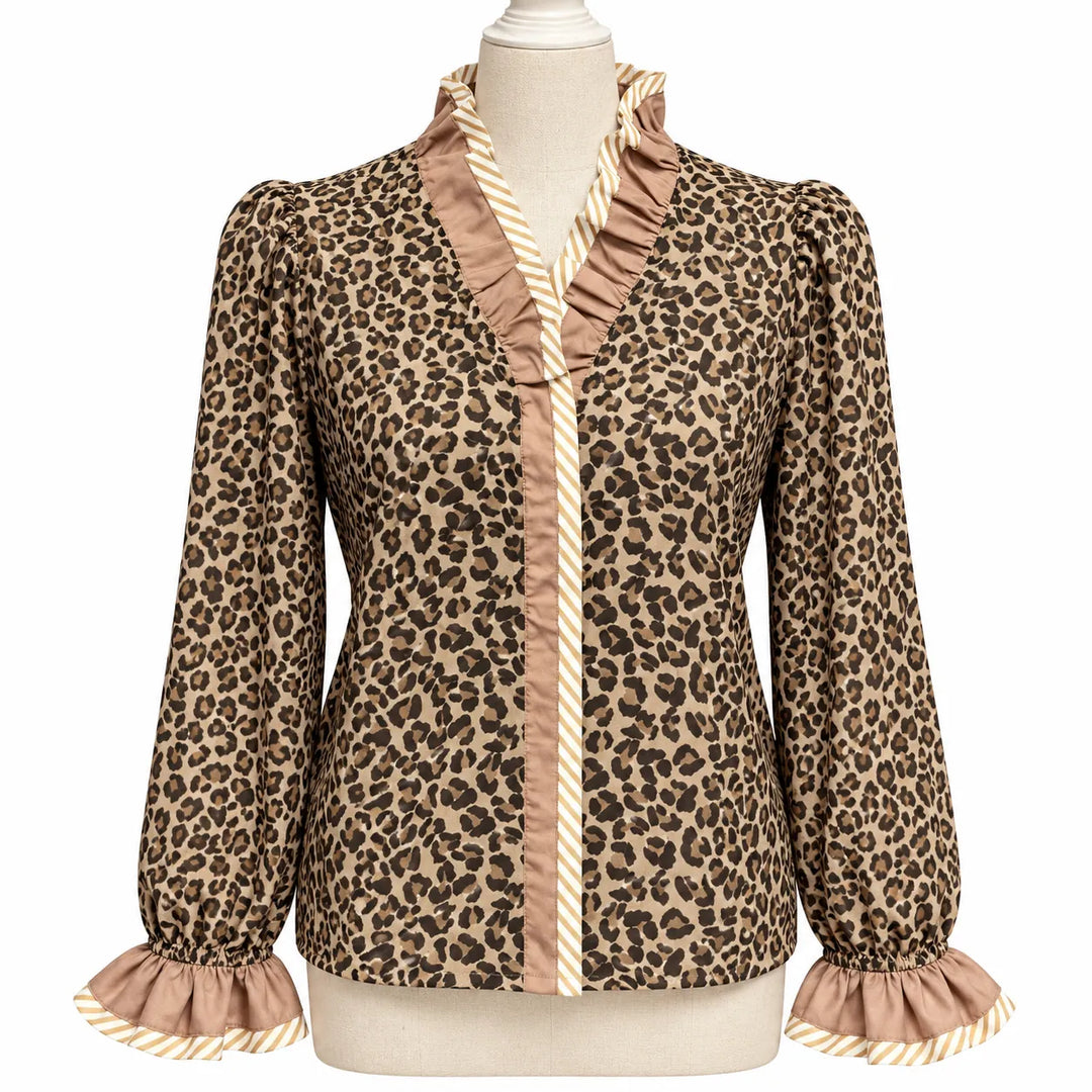 Wild Leopard Elegance blouse on a dress form, showing V-neck ruffles, striped trim, long sleeves and matching gathered cuffs.